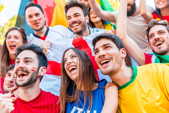 Multi-ethnic football fans celebrating sport event