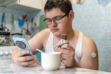 A diabetic raises low blood sugar levels. teenager with diabetes eats candy to control low blood...