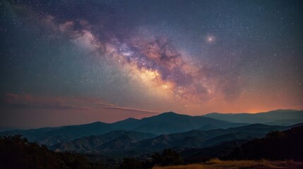 Fototapeta premium A breathtaking starry night sky over a mountain range with the Milky Way galaxy prominently visible, illuminated by the moon and stars, creating a mesmerizing and serene atmosphere.