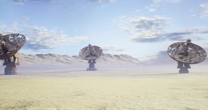 Satellite ground infrastructure in open plain, multiple parabolic dishes arranged for wide coverage under broad sky with distant mountain band, industrial