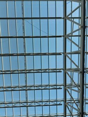 Abstract clear glass roofing covering an airport entrance