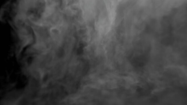 Falling white smoke in the light on the ground. Can be used as a special effect for your projects, video texture or background for designs, scenes, etc.