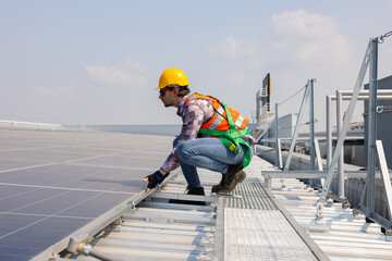 Solar Technician Inspecting Rooftop Solar Panel System