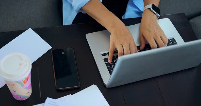 Hectic busy morning. Focused worker during morning chaos. An individual diligently working as morning rush unfolds. Person swiftly typing away while managing hectic start of day activities