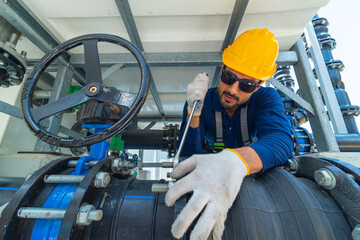 Industrial Technicians Tightening Pipe with Wrench
