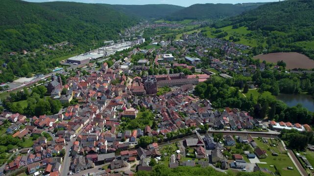 An aerial view beside the old town above the city Amorbach , Germany on a sunny day in spring