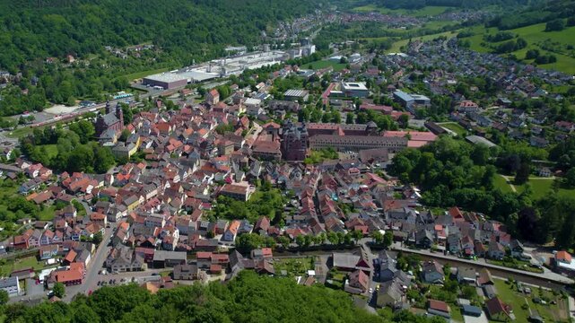 An aerial view beside the old town above the city Amorbach , Germany on a sunny day in spring