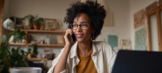 Fototapeta premium Woman using phone at desk