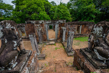 Ancient stone temple ruins with lion statues and doorways