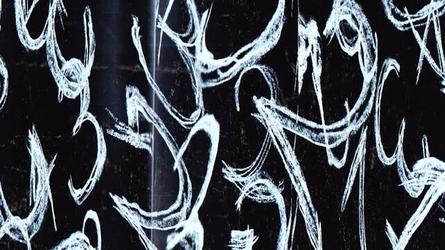 Abstract white brush strokes on a dark background, creating a dynamic and artistic visual effect.