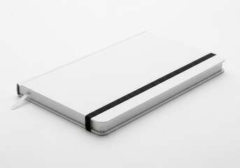 A white notebook with a black elastic band on a plain white background.