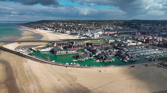 Aerial drone view seaside of the neighboring towns of Trouville-sur-Mer and Deauville, Normandy, France, October 20, 2025. High quality 4k footage
