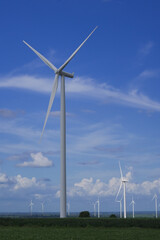 Fototapeta premium wind turbines farm. photos of wind turbines providing renewable green energy. Windmill. Clean power technology