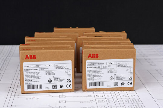 ABB equipment in cardboard packaging on an electronic digram during the assembly of the electrical control panel.