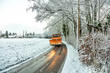 snowplow clearing roads of snow and fallen tree © travelview