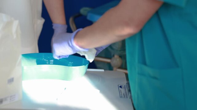 Preparation of compresses and water in kidney dish for stoma care using hygienic technique in clinical nursing