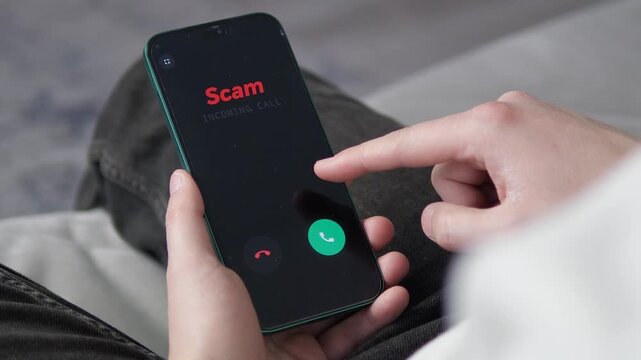 Incoming scam call on a mobile phone. Close-up of a person about to interact with a phishing attempt. Essential footage for content on identity theft, online crime, and modern social engineering