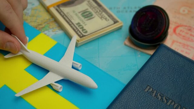 Travel concept with airplane, stamped passport, and money over world map showing Sweden flag, symbol of international tourism.