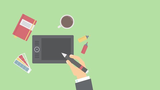 Graphic designer workspace with tablet and coffee stylus