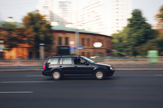Ukraine, Kyiv - 16 July 2021: Black Volkswagen Golf car moving on the street. Editorial