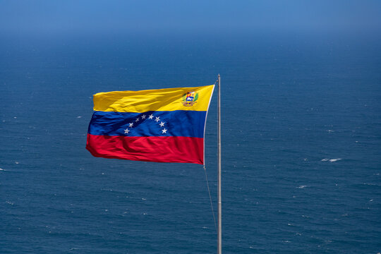 Venezuelan flag waving in the Caribbean Sea