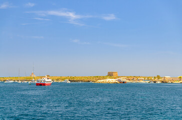 Fototapeta premium Tabarca Island Nueva Tabarca Isla Plana with port, Fort Fuerte building and ferry boats in Mediterranean Sea water in sunny summer day with blue sky, Alicante province, Valencian Community, Spain