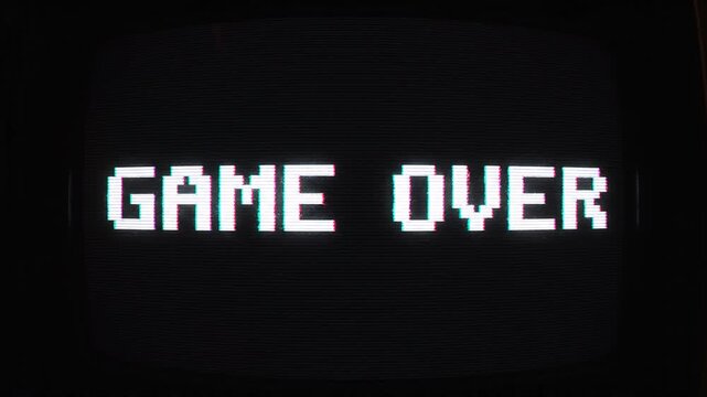 retro pixel game over screen close up on old crt monitor