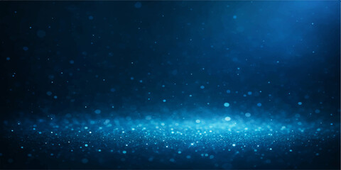 A cosmic nebula illuminates a dark blue abstract starfield across the starry night sky of the outer space universe © Hena