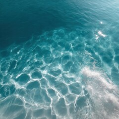 Turquoise water sunlight ripples shallow sea surface with sparkling light patterns and gentle wave reflections on clear ocean blue