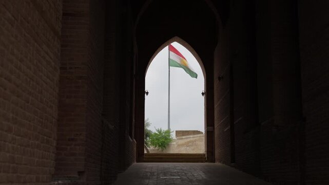 The flag of Iraqi Kurdistan in the citadel arch Erbil