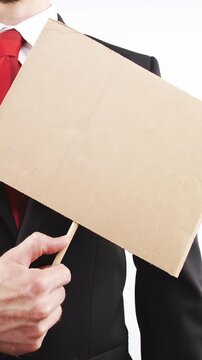 Hold up a blank banner headless red tie business person