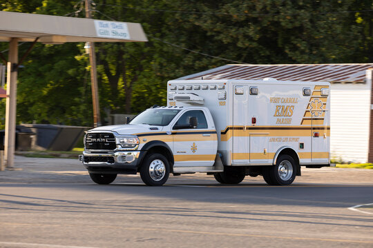 Epps, Louisiana, USA - April 22, 2024: A West Carroll Parish EMS ambulance races to the scene of an emergency.
