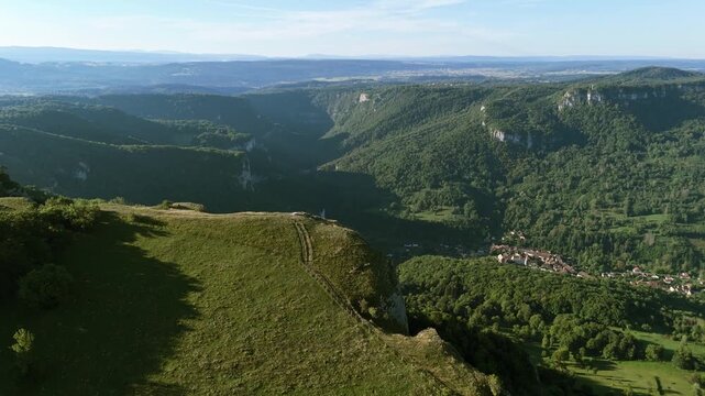 Aerial drone footage of flight over the cliff of the Haute Pierre Mountain in the French Jura near Lods in France