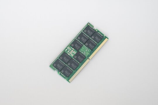 High-resolution product shot of a green DDR5 ECC RAM module with gold contacts, featuring SK hynix chips, isolated on white background.
