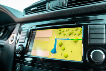 Modern vehicle parking with multiple camera sensors activated on dashboard display, demonstrating driver assistance technology helping maneuver and park safely.