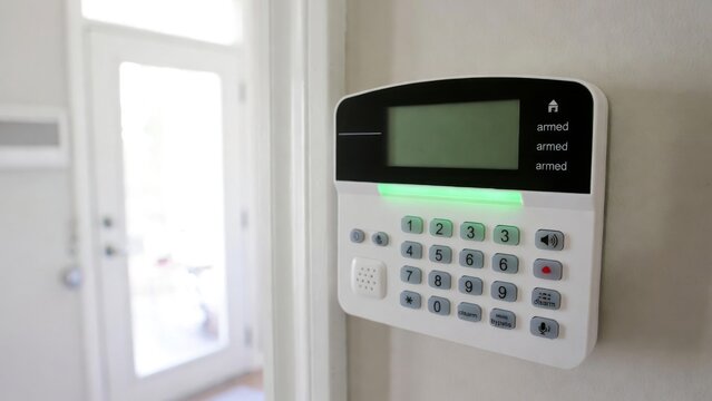 Home Security Alarm System Keypad Panel Mounted on Wall