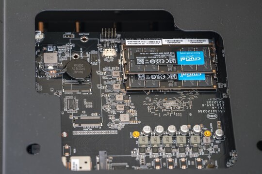 Mini PC with DDR5 RAM Modules Installed, Close-Up View of Motherboard and Crucial Memory Sticks. Detailed shot of a mini computer motherboard specially designed for AI and data centers in small size