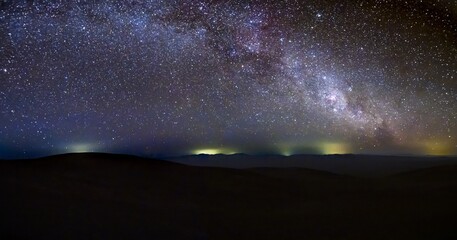 Panoramic nightscape of Atacama Desert under Milky Way galaxy. Breathtaking panoramic view of the...