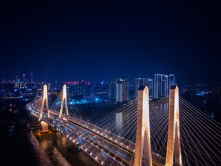 Obraz premium Aerial night view of Guangzhou China city lights and bridge architecture
