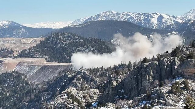 Dynamite blasting operations in mines that harm the environment and nature.