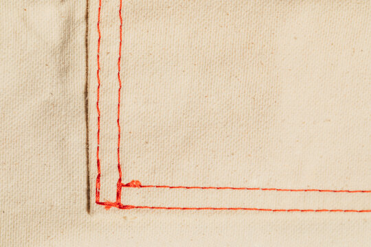 red stitching on cotton canvas
