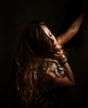 Moody portrait of a woman in a fur vest