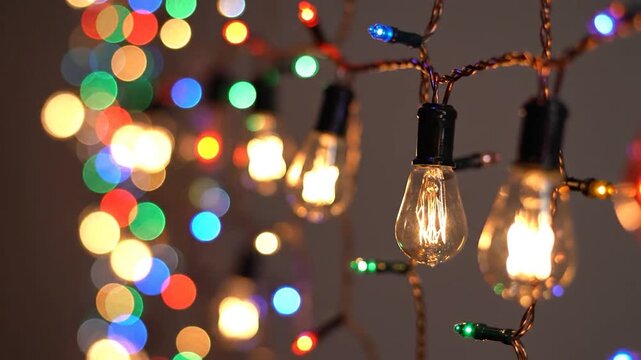 Vibrant colorful holiday string lights glowing.