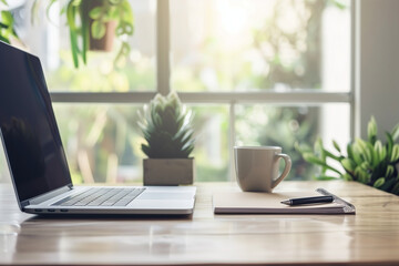 Fototapeta premium Minimalist Home Office Desk with Laptop and Plant in Natural Light
