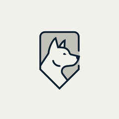 Fototapeta premium Modern minimalist logo of a dog's head inside a shield shape, vector illustration