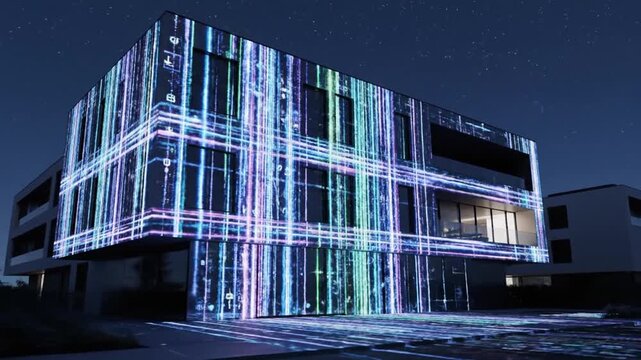 Modern building exterior with vibrant light projections under night sky