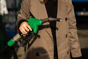 Fuel station close-up with hand on petrol nozzle © Rabizo Anatolii
