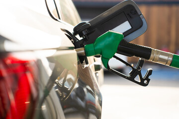 Close-up of petrol fuel nozzle in car fuel tank © Rabizo Anatolii