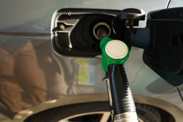 Car refueling scene with gasoline pump nozzle close-up © Rabizo Anatolii