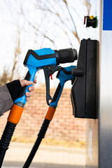 Driver refilling automobile with LPG fuel using gas station nozzle © Rabizo Anatolii